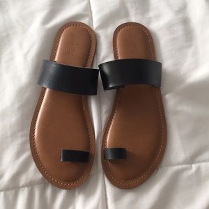 Black strap sandals.